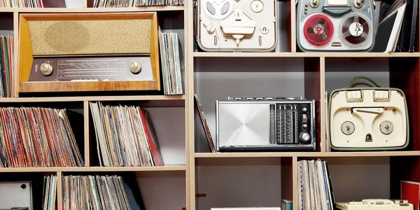 Vintage media and collectibles on shelves